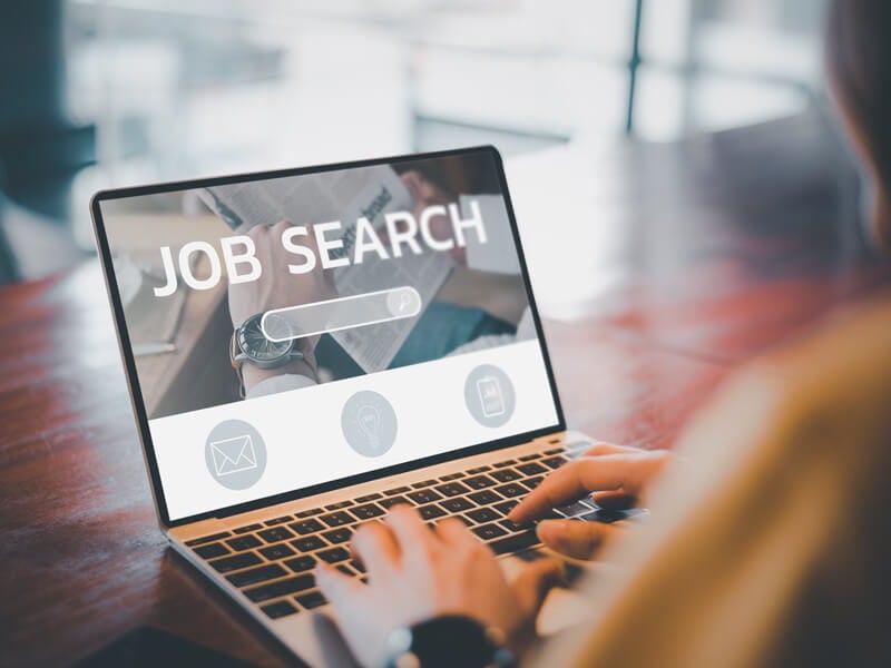 female doing a job search on her computer