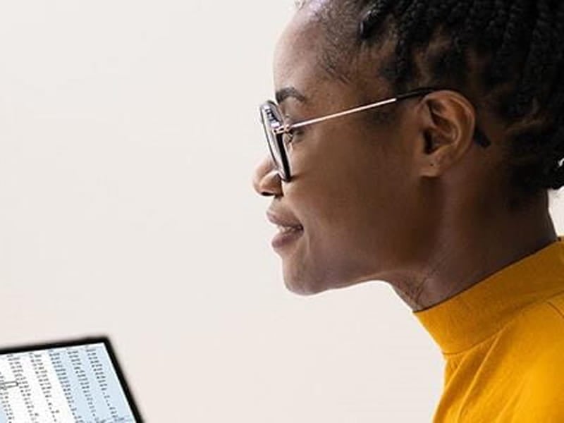 Woman looking at spreadsheet data.