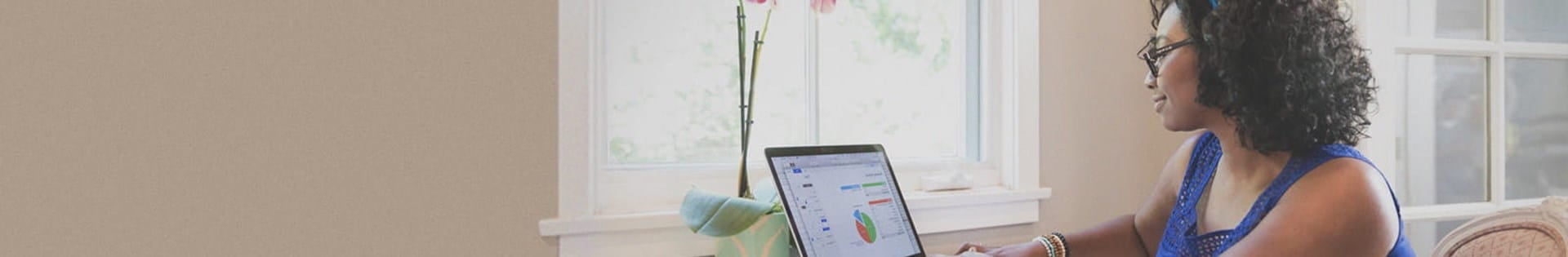 female_student_studying_by_window_at_home_daylight
