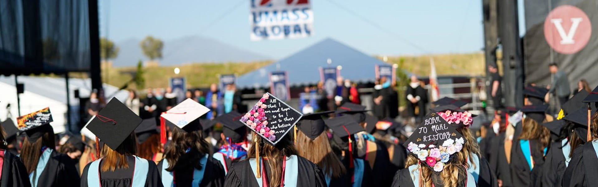 Students watching stage at graduation.