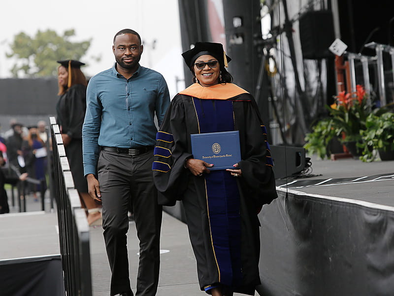 UMass Global DNP Grad with Family Member