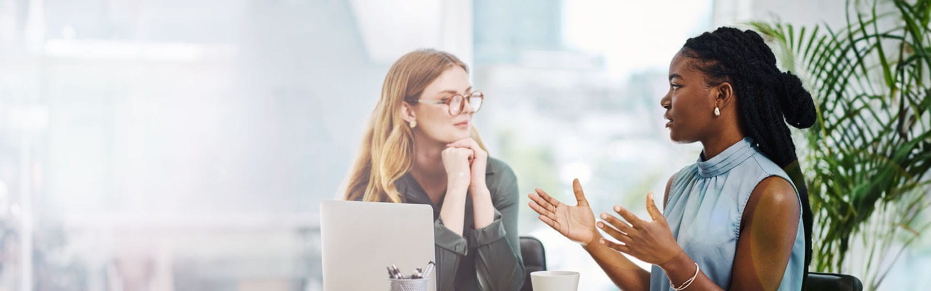 female HR professional in office speaking to a coworker