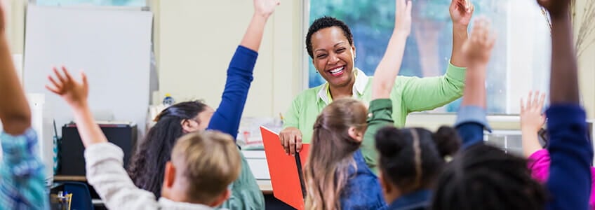 teacher leading classroom of students