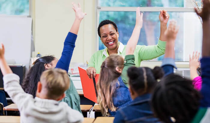 teacher leading a classroom of students