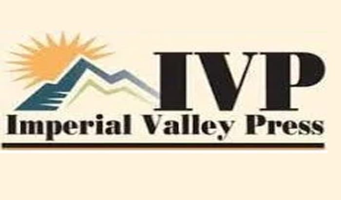 The logo for the Imperial Valley Press, which depicts a sun behind a mountain next to the letters "IVP," both of which are above the newspaper's name.