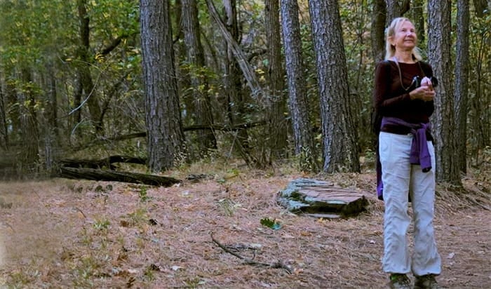 Executive Vice Chancellor Nancy Salzman standing in a forest