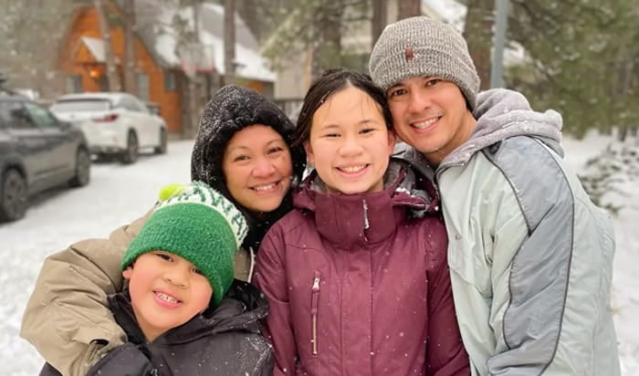 A photo of UMass Global Dean of Extended Education Ricardo Lorenzana, at right, with members of his family.