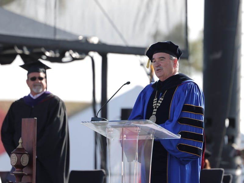 Chancellor Andrews speaking at commencement.