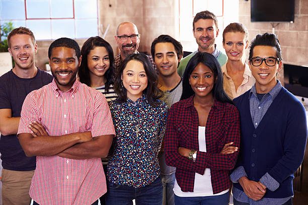A group of diverse people posing for a photo.