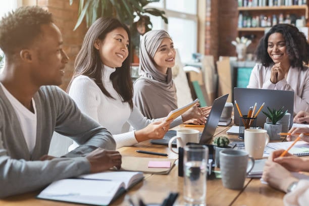 A diverse group of people in a meeting.