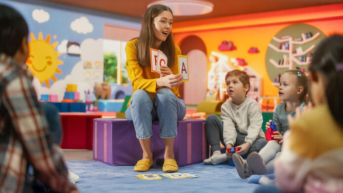 Kindergarten teacher with children