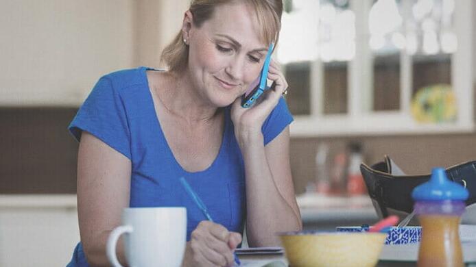 female_with_phone_writing_on_kitchen_counter_1_459_717x440.jpg