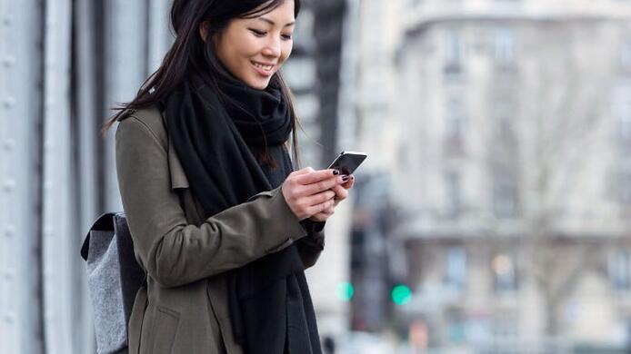female_looking_at_news_on_phone
