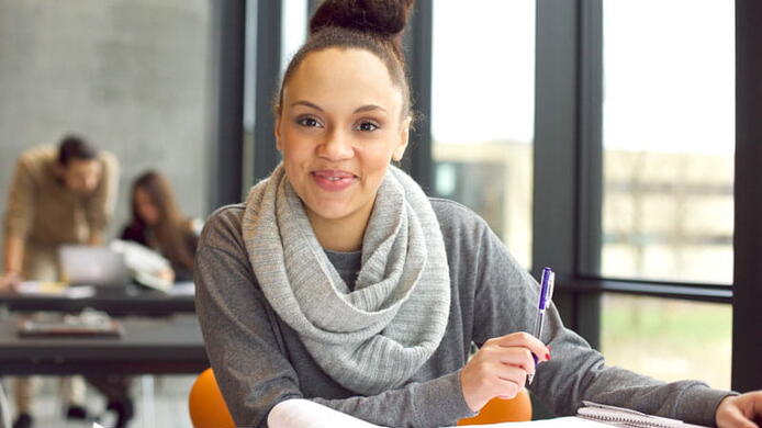 Young female transfer student studying.