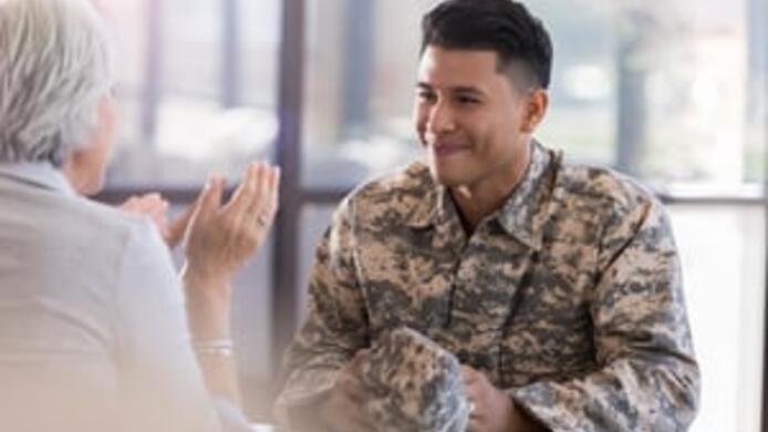 military man smiling to a old woman