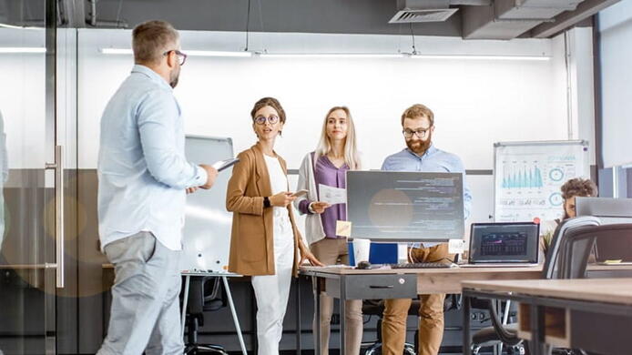 group of colleagues working together in a modern office environment