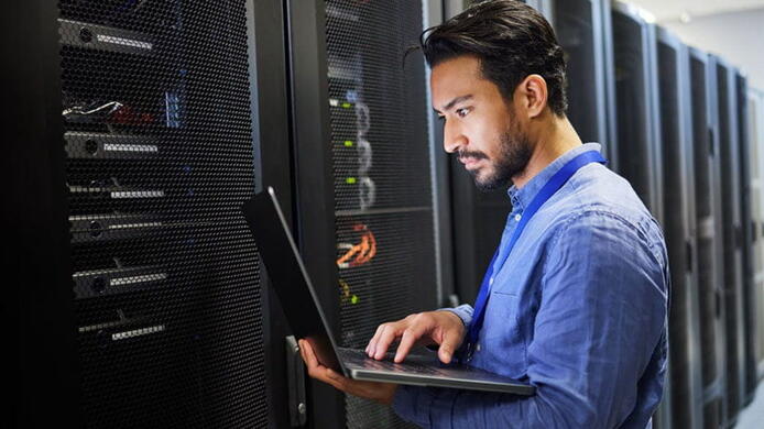 IT professional using computer for server administration