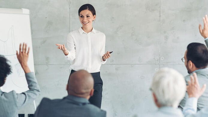 female leader leading a team brainstorm