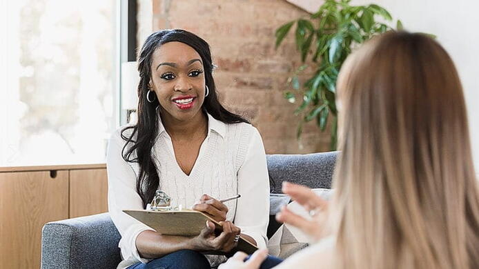 female school counselor supporting female student in career counseling