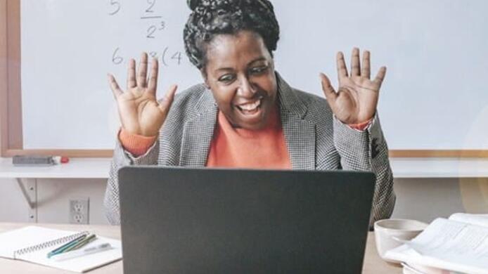 Happy teacher inspiring kids online