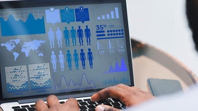 a person on their computer reviewing different data analytics charts.
