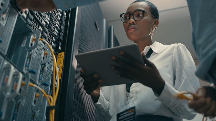 woman looking at a computer server