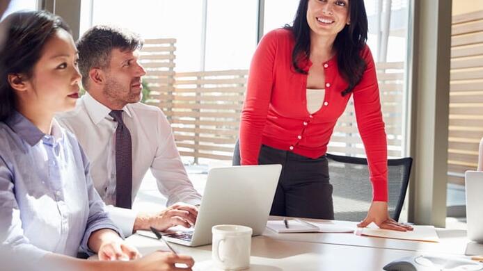 a corporate woman discussing something in the meeting