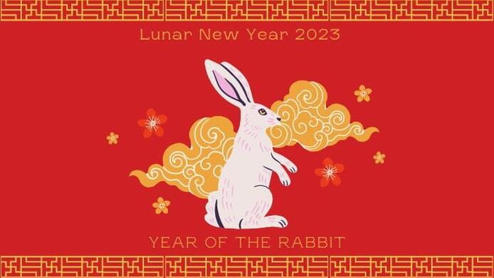 A graphic including the image of a white rabbit over the a red background with the phrases Lunar New Year 2023 and Year of the Rabbit.