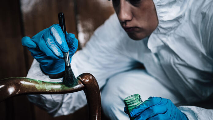 Crime scene investigator finger print dusting