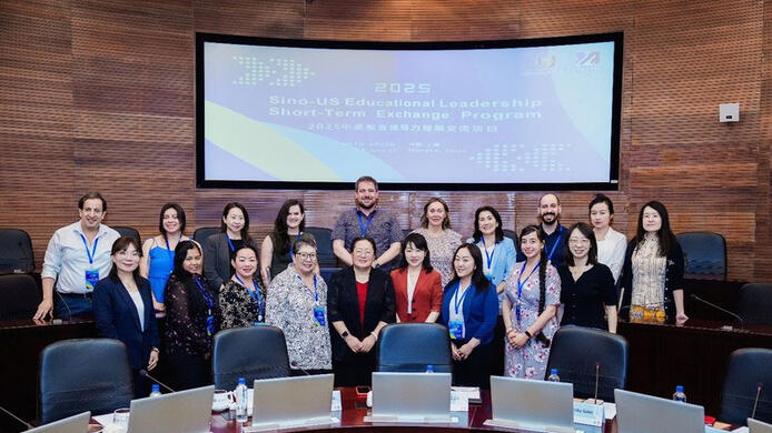 umass global visits shanghai open university