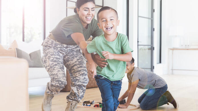 Woman soldier with her kids