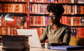 Lawyer doing research in a library