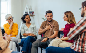 Counselor talking to a group of people