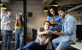 Team collaborating on a laptop