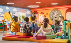 Kindergarten teacher with children