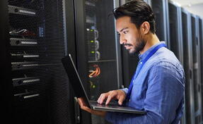 IT professional using computer for server administration