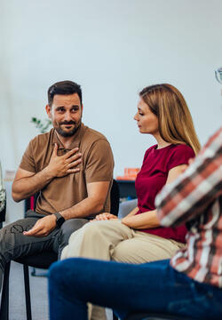 Counselor talking to a group of people