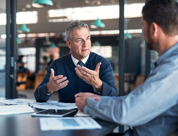 Two people talking in the office