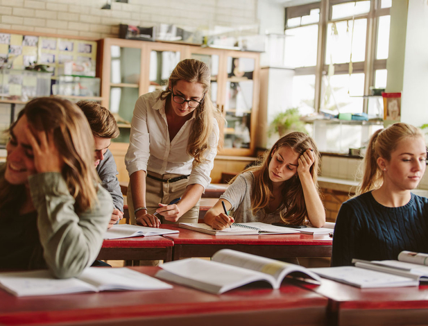 Highschool teacher and students in class
