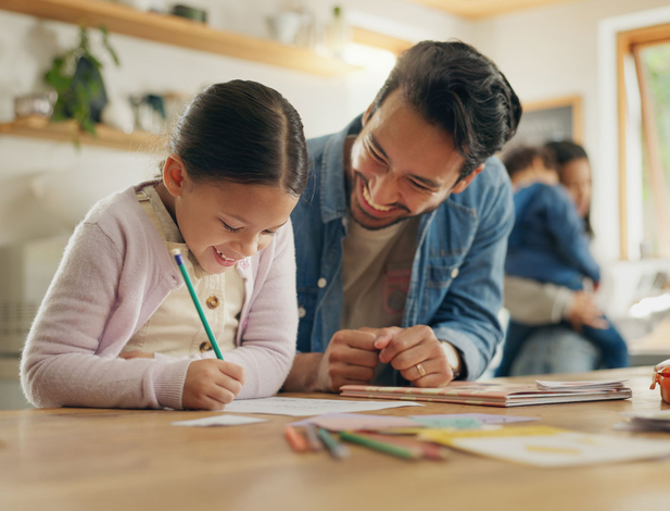 Father and daughter reading at home