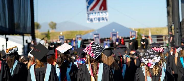 Students at commencement watching the stage.
