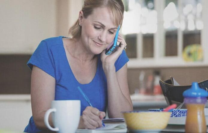 female_with_phone_writing_on_kitchen_counter_1_459_717x440.jpg