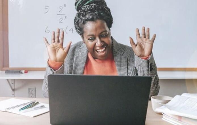 Happy teacher inspiring kids online
