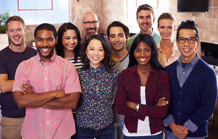 A group of diverse people posing for a photo.