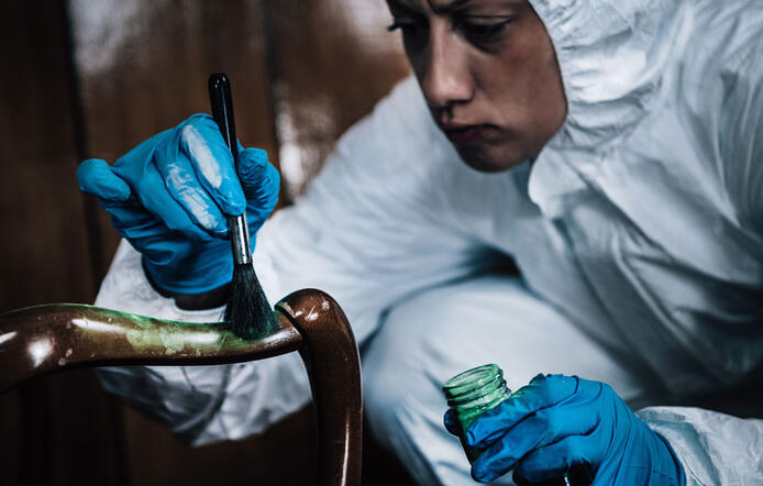 Crime scene investigator finger print dusting