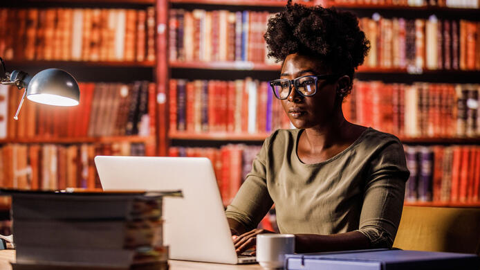 Lawyer doing research in a library