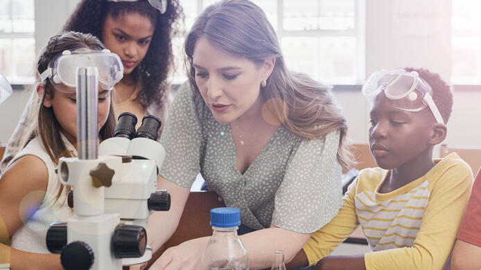 Elementary teacher teaching science to students