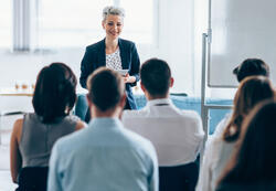 Businesswoman leading a training class for professionals