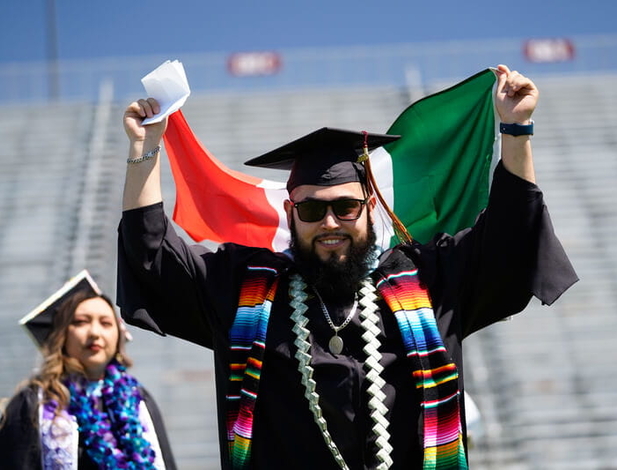 UMass Global graduate showing off his Hispanic heritage